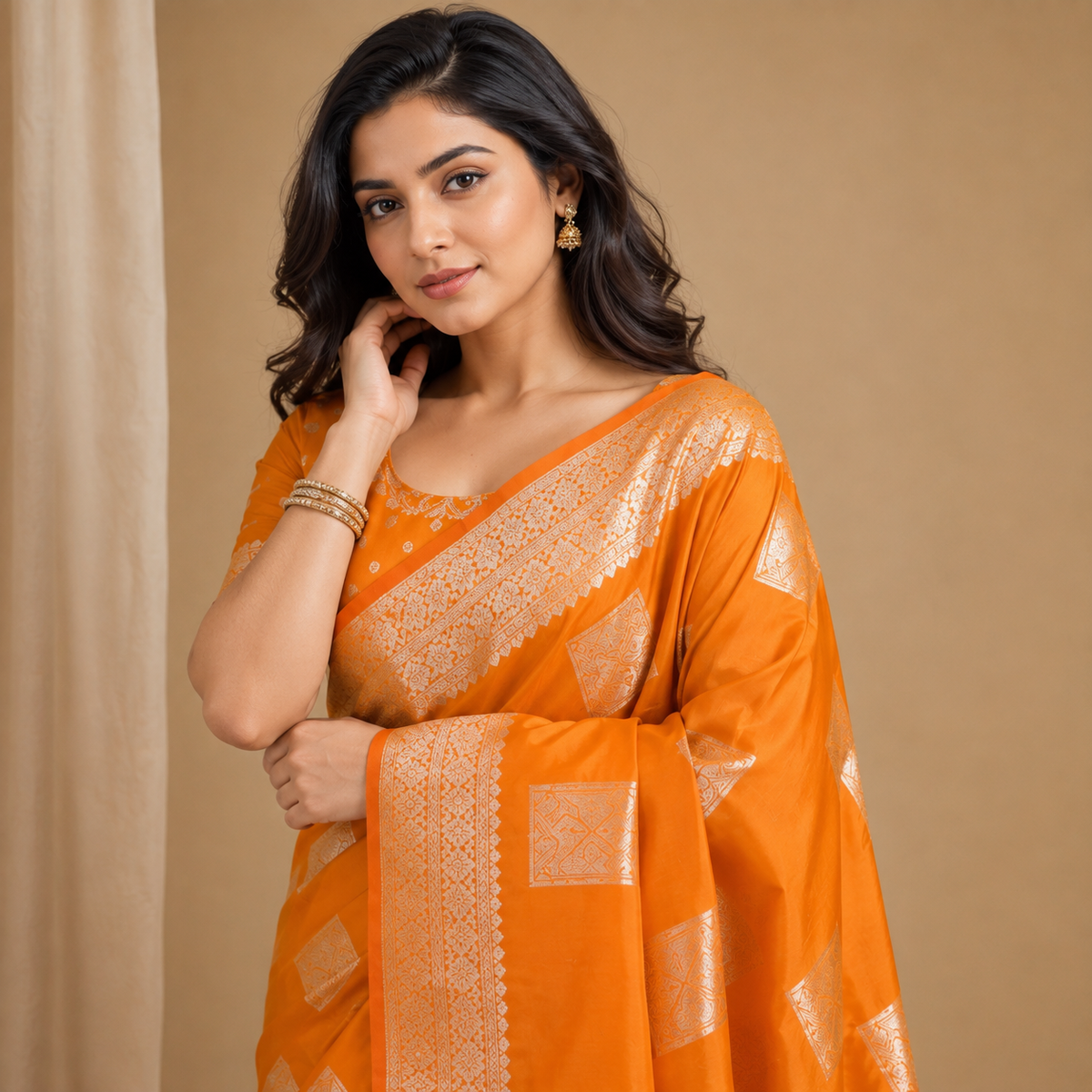 Orange Silk Saree with Silver Motifs