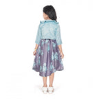 Young girl wearing a blue floral fit and flare dress with a matching 3/4 sleeve shrug and stylish flats