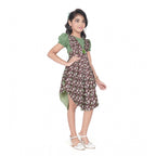 Young girl wearing a green floral layered asymmetrical dress with puff sleeves and stylish white flats