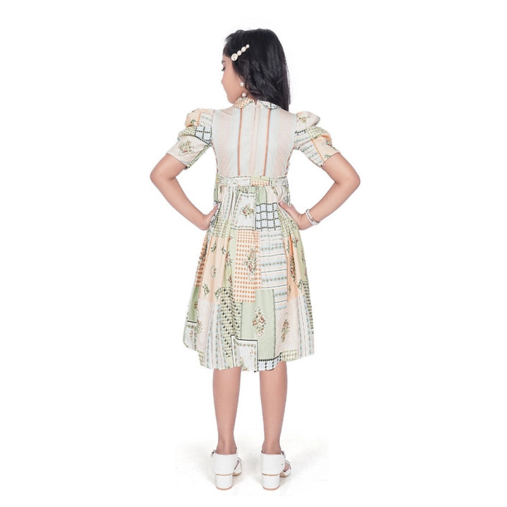 Girl wearing beige printed fit and flare dress with puff sleeves