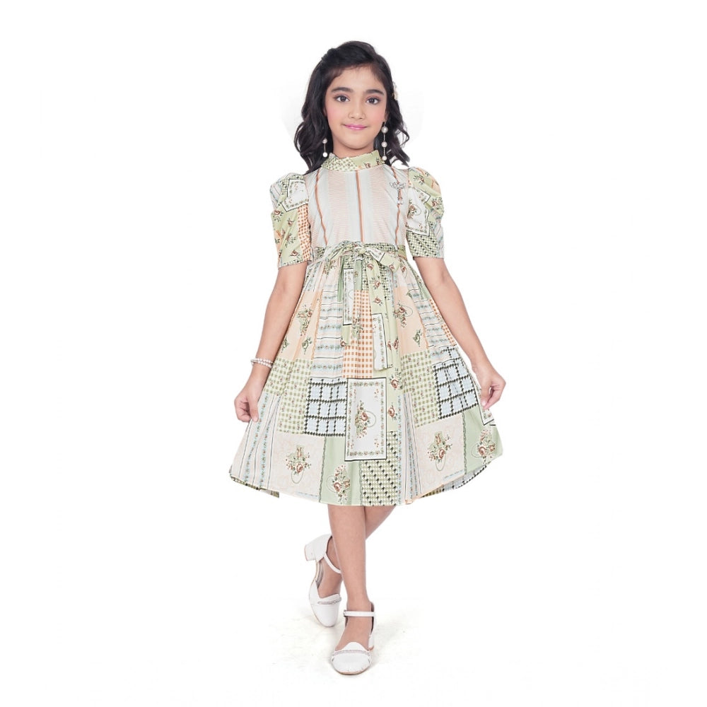 Girl wearing beige printed fit and flare dress with puff sleeves