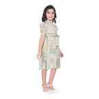 Girl wearing beige printed fit and flare dress with puff sleeves
