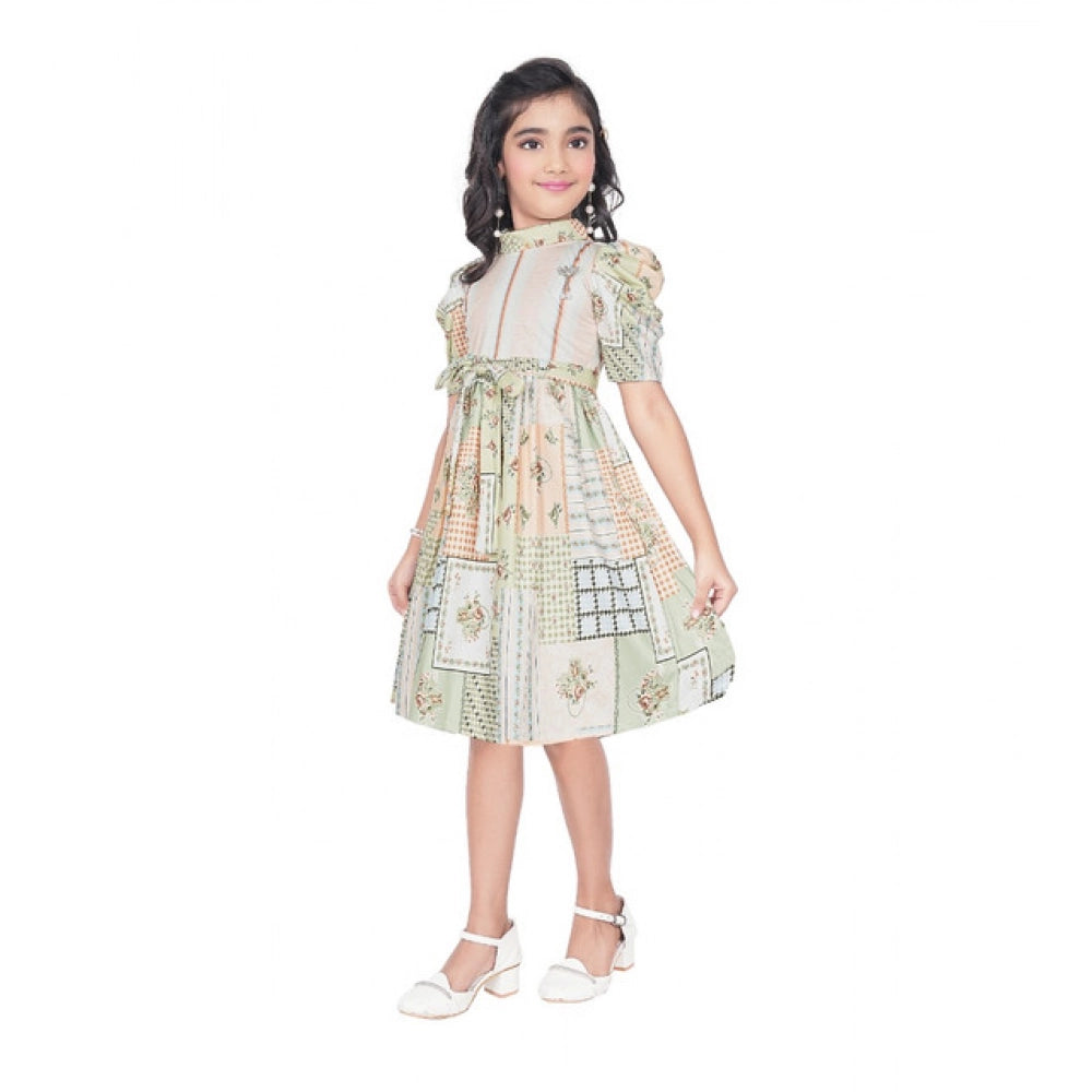 Girl wearing beige printed fit and flare dress with puff sleeves