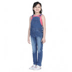 Young girl wearing a blue denim dungaree jumpsuit with pink sleeveless top