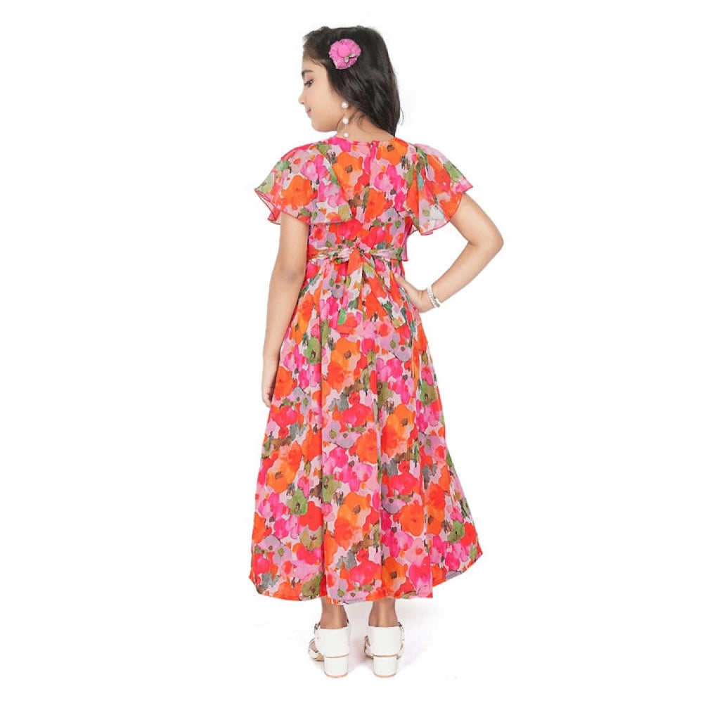 Young girl wearing a vibrant red and pink floral print party wear dress with flutter sleeves
