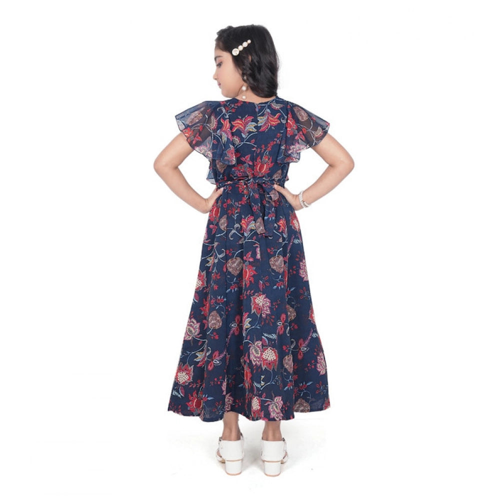 Girl wearing navy blue floral printed maxi dress with flutter sleeves