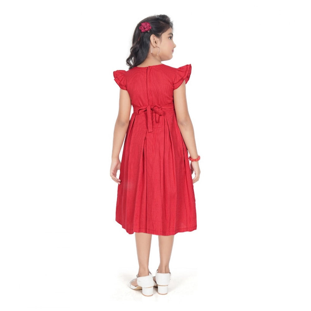 Girl wearing red fit and flare party wear dress with flutter sleeves