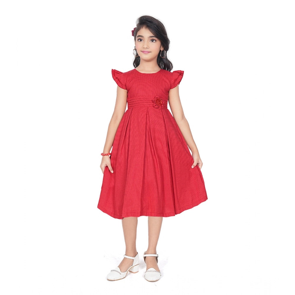 Girl wearing red fit and flare party wear dress with flutter sleeves