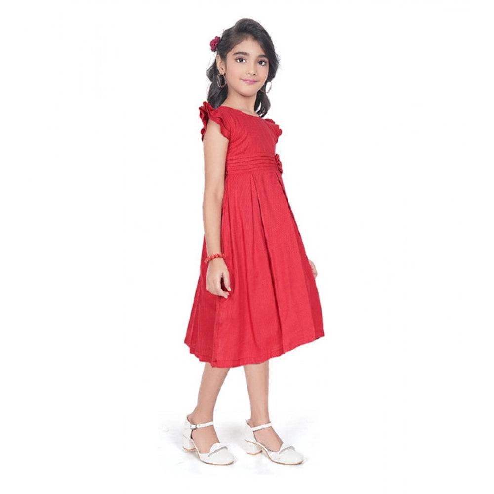 Girl wearing red fit and flare party wear dress with flutter sleeves