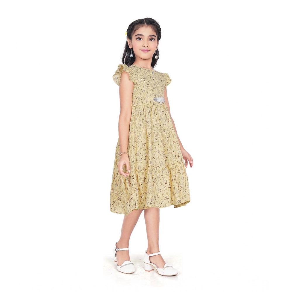 Girl wearing yellow floral party wear dress with cap sleeves