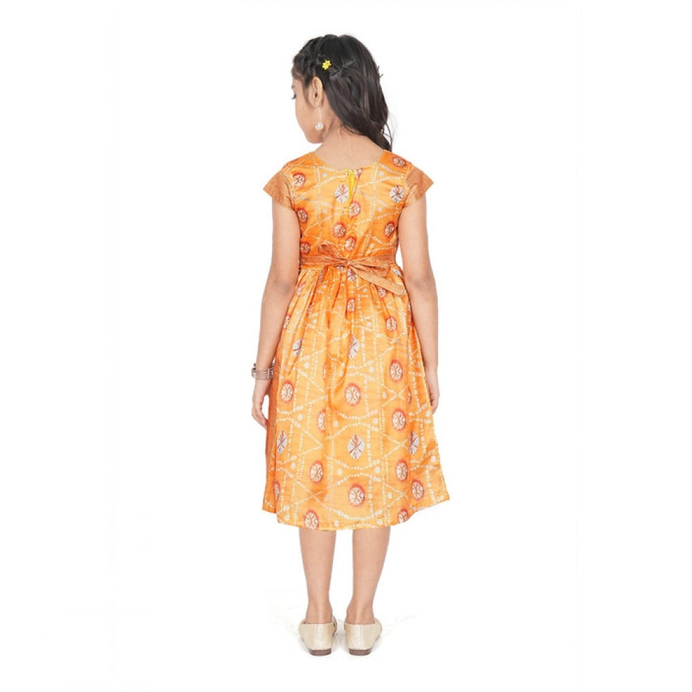 Young girl wearing a premium mustard yellow Banarasi silk frock with traditional woven zari borders, ideal for festive Indian celebrations