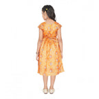 Young girl wearing a premium mustard yellow Banarasi silk frock with traditional woven zari borders, ideal for festive Indian celebrations
